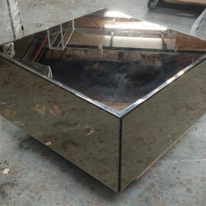 Showroom unit features a mirrored coffee table (80% new)